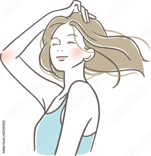 風に髪を靡かせる女性
