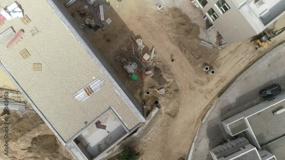 New building construction. Construction workers in the Roof New building construction. Construction workers in the Roof