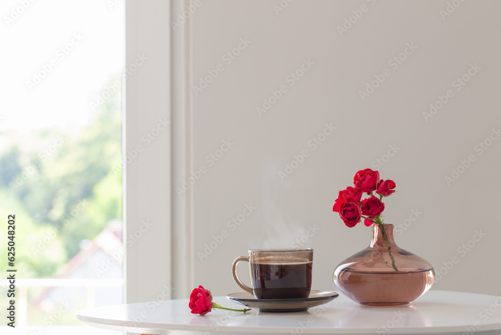 cup of tea and bouquet of roses in white interior cup of tea and bouquet of roses in white interior