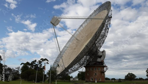 Radio telescope moving in time-lapse against the sky at Parkes, New South Wales, Australia. photo