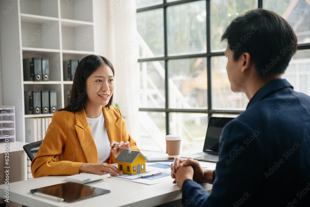 Signing a contract. Client and broker agent, lease agreement, successful deal and Young business sitting at the desk in office . Signing a contract. Client and broker agent, lease agreement, successful deal and Young business sitting at the desk in office .