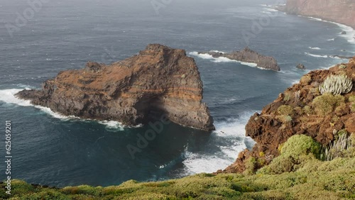 Coast of La Palma in the Canary Islands - Waves off the Atlantic Ocean hit the cliffs of volcanic coastline photo