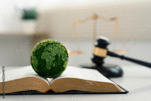 world and wooden gavel with a golden scale for law international environmental concept of business corporate and industry. law world for environmental regulation.sustainable environment concept photo