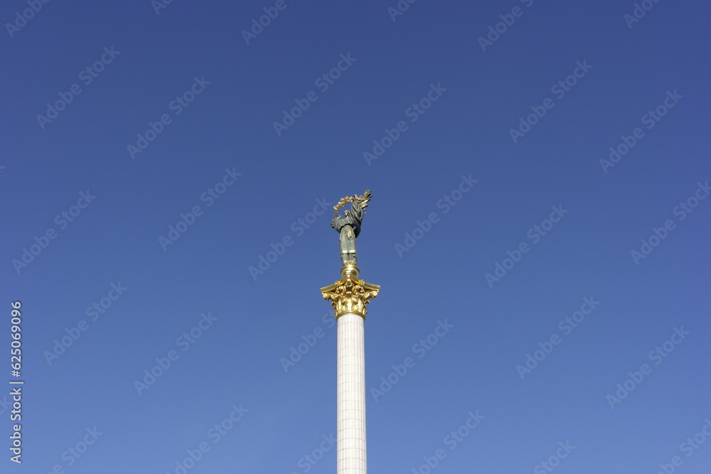 Independence monument towering in the bright blue sky