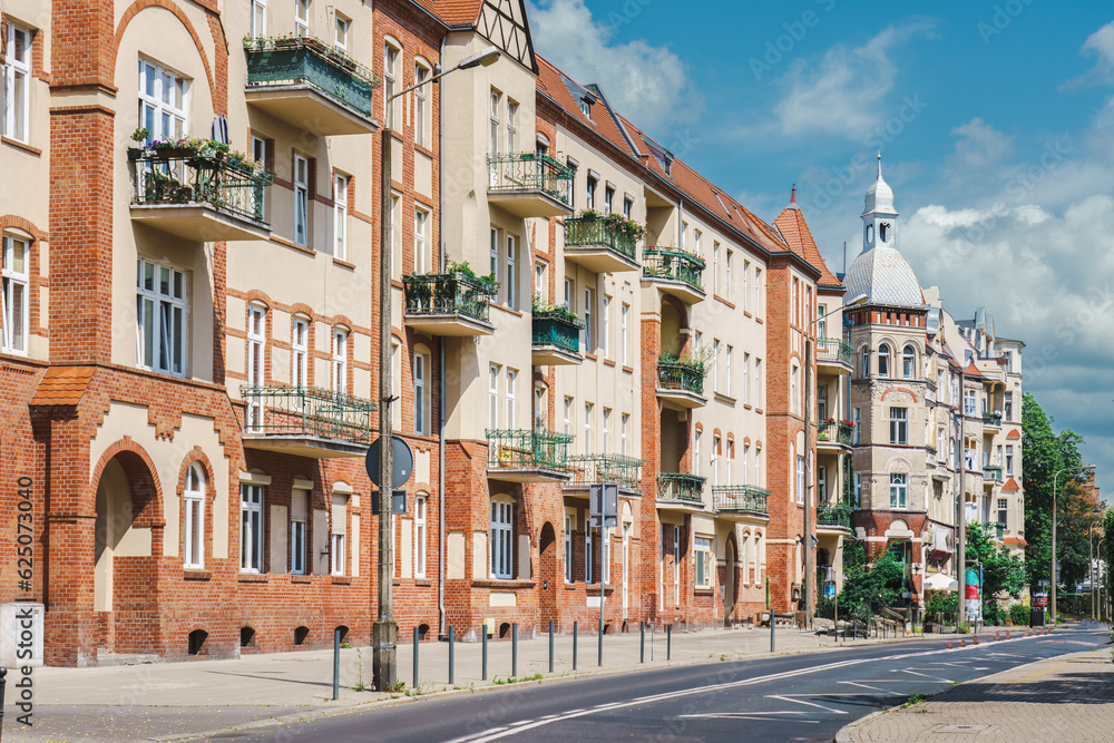 Real estate. Historic city tenement houses. European city street. Residential district.