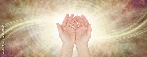 Sensing Golden Healing Life Force Energy Healing Vibes  - female open hand facing outwards against a white and gold spiralling vortex energy field background with copy space