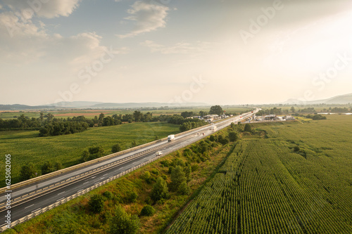 Aerial panoramic photo from above with A1 highway road between Sebes and Deva. Drone photo with the roads of Romania. Aerial view during sunset after a summer storm.