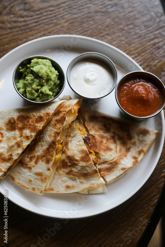 Traditional chicken quesadilla with sauces