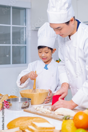 father and son cooking