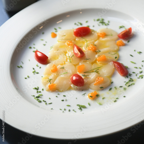 Scallop crudo with tomatoes and herbs