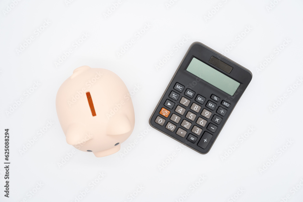 Piggy bank with Calculator on isolated background. Saving money and financial management. Piggy bank with Calculator on isolated background. Saving money and financial management.