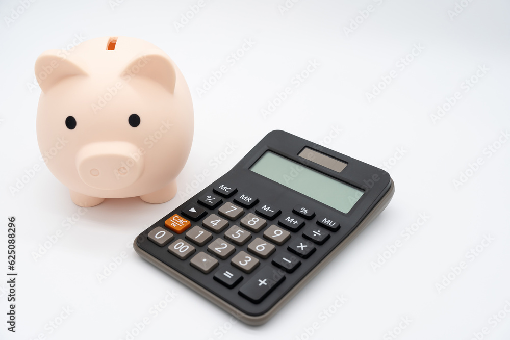 Piggy bank with Calculator on isolated background. Saving money and financial management. Piggy bank with Calculator on isolated background. Saving money and financial management.