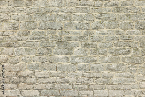 Fototapeta Stone wall of an old house. Full frame pattern or texture, UK