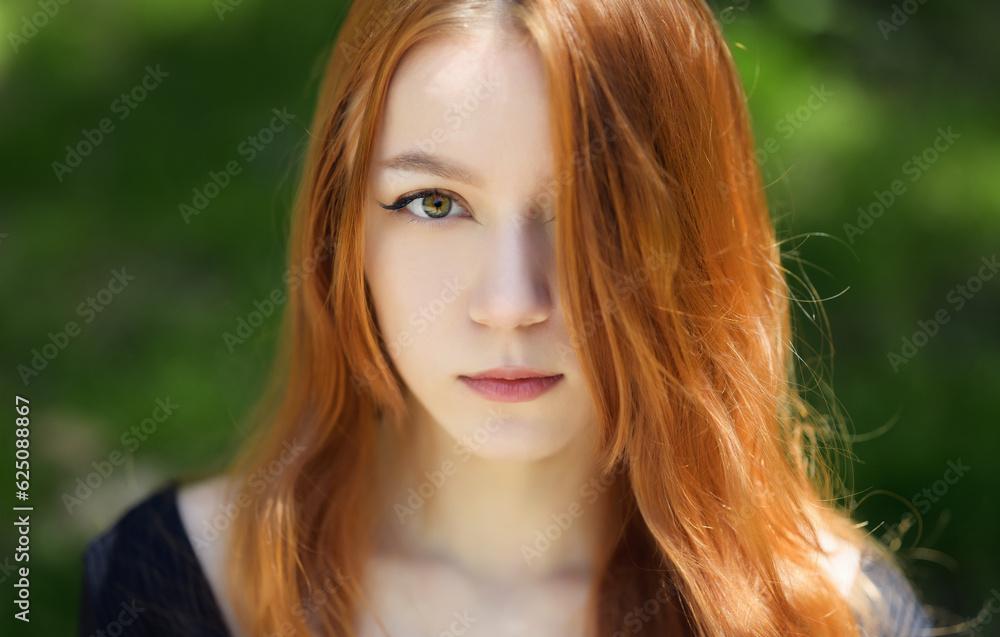 Portrait of beautiful young woman with red hair. Portrait of beautiful young woman with red hair.