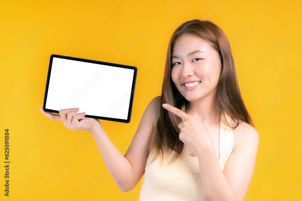 beautiful Asian young woman showing smart phone , tablet phone computer with blank screen ,white screen ,empty copy space for advertising banner isolated on on yellow background , Mock Up Image beautiful Asian young woman showing smart phone , tablet phone computer with blank screen ,white screen ,empty copy space for advertising banner isolated on on yellow background , Mock Up Image