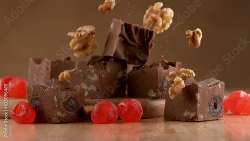 Chocolate fudge with nuts slow motion photo