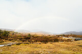 Rainbow across road at Ronny Creek in Cradle Mountain, Tasmania, Australia