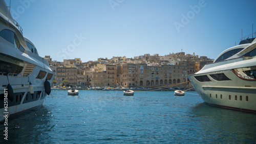 2 yachts, 3 buoys and limestone buildings the view of 3 cities in Malta  © Nikita