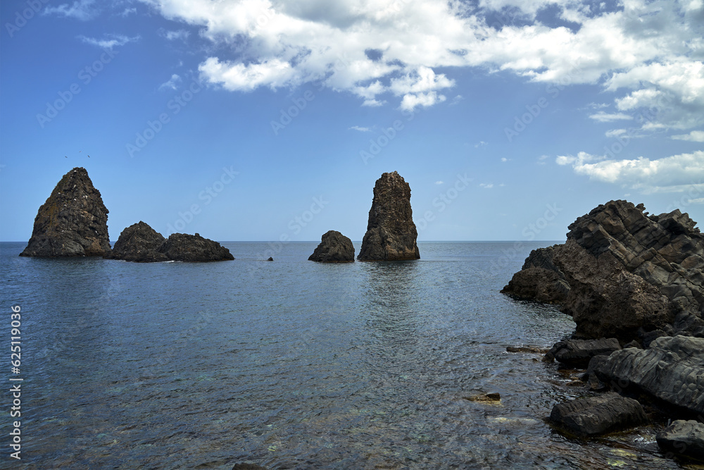 Rocky islet on the Cyclops coast on the island of Sicily