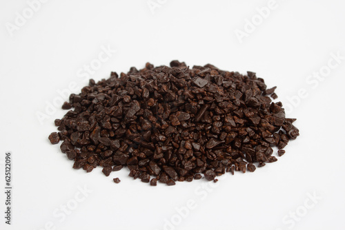 Dark chocolate chips on a white background