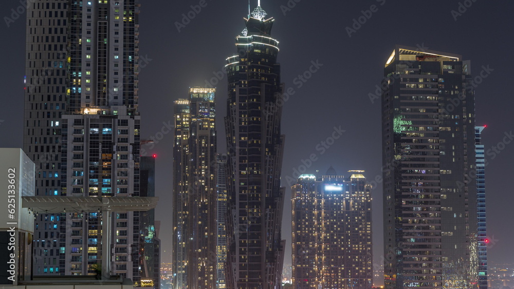 Business bay district skyline with modern architecture night timelapse from above.