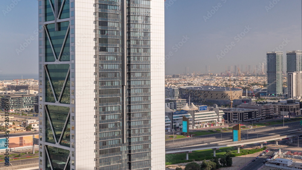 Aerial panoranic view to Dubai City Walk district behind skyscraper timelapse from above