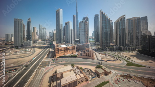 Aerial view of Dubai Downtown skyline with many towers all day timelapse.