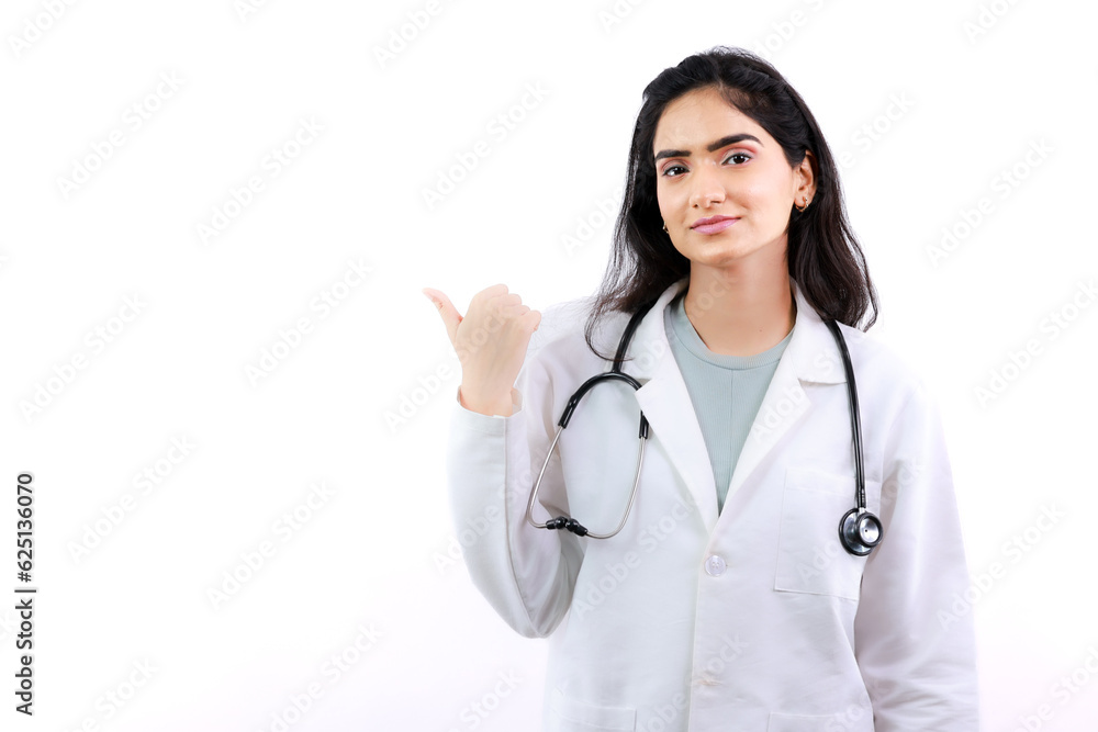 Thumb Pointing to the Left by Young Indian Female Doctor in Coat-Face Expressions and Hand Gesture Thumb Pointing to the Left by Young Indian Female Doctor in Coat-Face Expressions and Hand Gesture