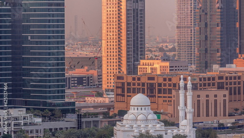 Photography New white mosque near bay avenue surrounded by skyscrapers in Business Bay district aerial timelapse