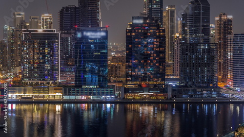 Aerial view to Dubai Business Bay and Downtown with the various skyscrapers and towers night timelapse © neiezhmakov