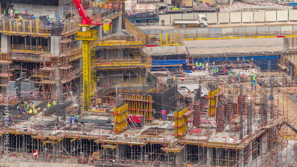 Large construction site with many working cranes timelapse.