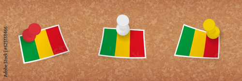 Mali flag pinned in cork board, three versions of Mali flag.