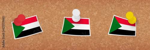 Sudan flag pinned in cork board, three versions of Sudan flag.