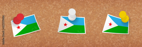 Djibouti flag pinned in cork board, three versions of Djibouti flag.