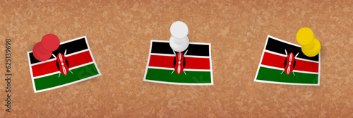 Kenya flag pinned in cork board, three versions of Kenya flag.