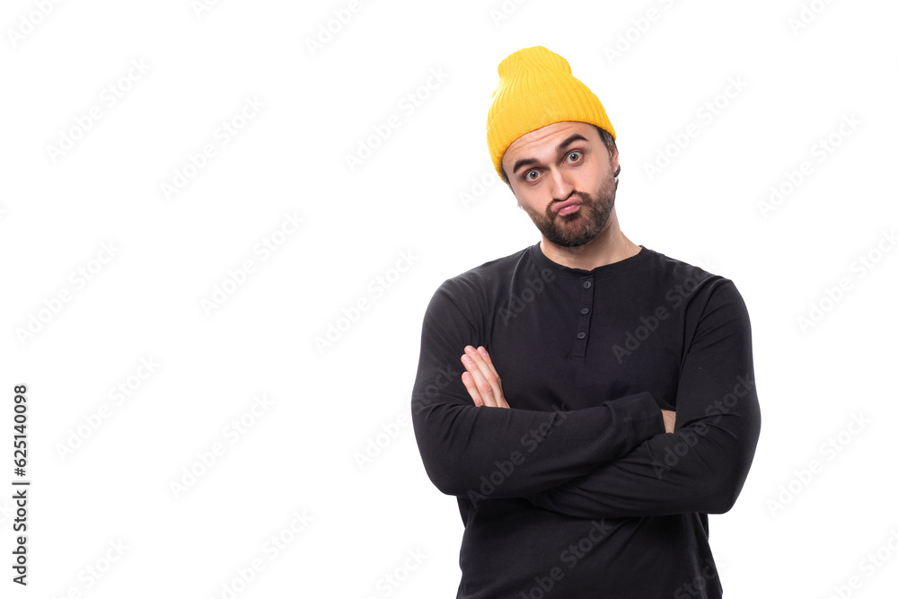 handsome young 30 year old guy with a beard dressed casually looks at the camera on a white background with copy space handsome young 30 year old guy with a beard dressed casually looks at the camera on a white background with copy space