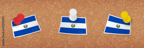 El Salvador flag pinned in cork board, three versions of El Salvador flag.