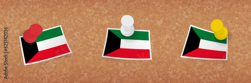 Kuwait flag pinned in cork board, three versions of Kuwait flag.