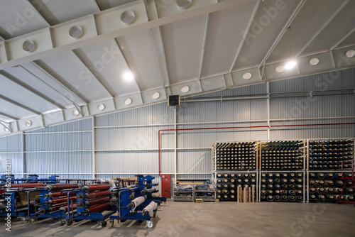 Big warehouse with paper rolls and printing material photo