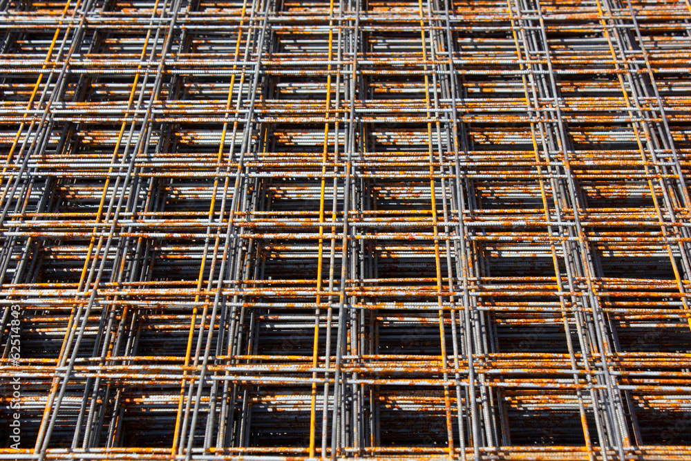 Reinforcing cages for foundation.Reinforcing mesh at the construction site.Metal mesh stack. Warehouse, production of steel construction mesh.