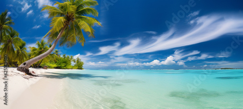 Beautiful beach with white sand, turquoise ocean, blue sky with clouds and palm tree over the water © MUS_GRAPHIC