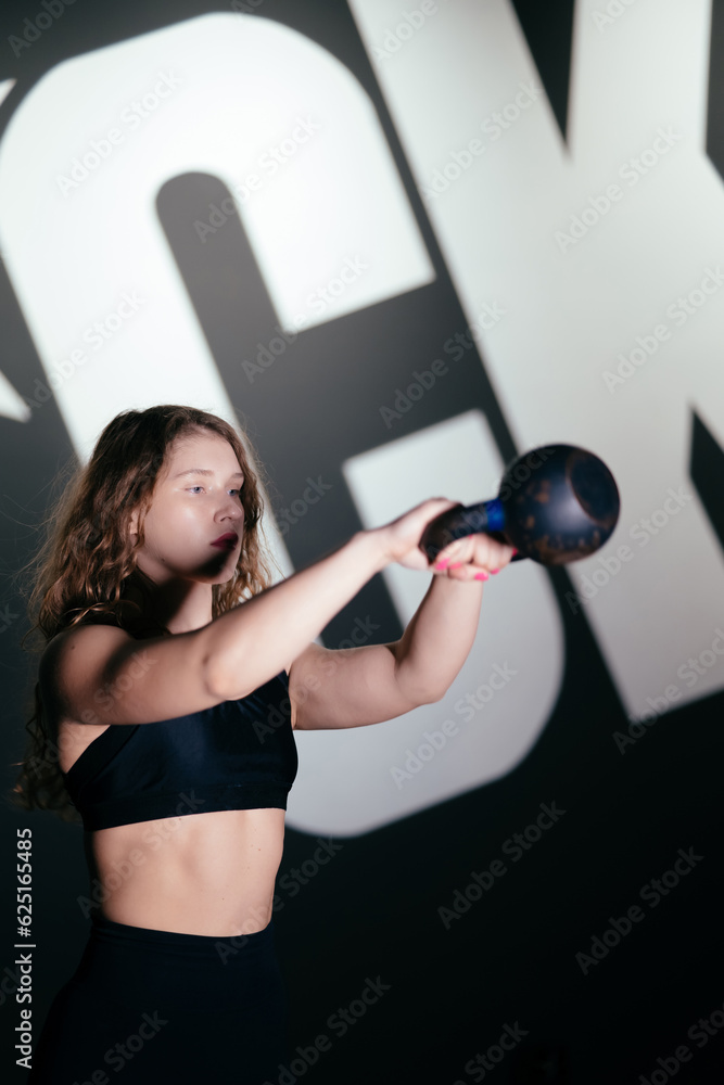 Athletic Beautiful Woman Does her cross fitness at gym Athletic Beautiful Woman Does her cross fitness at gym