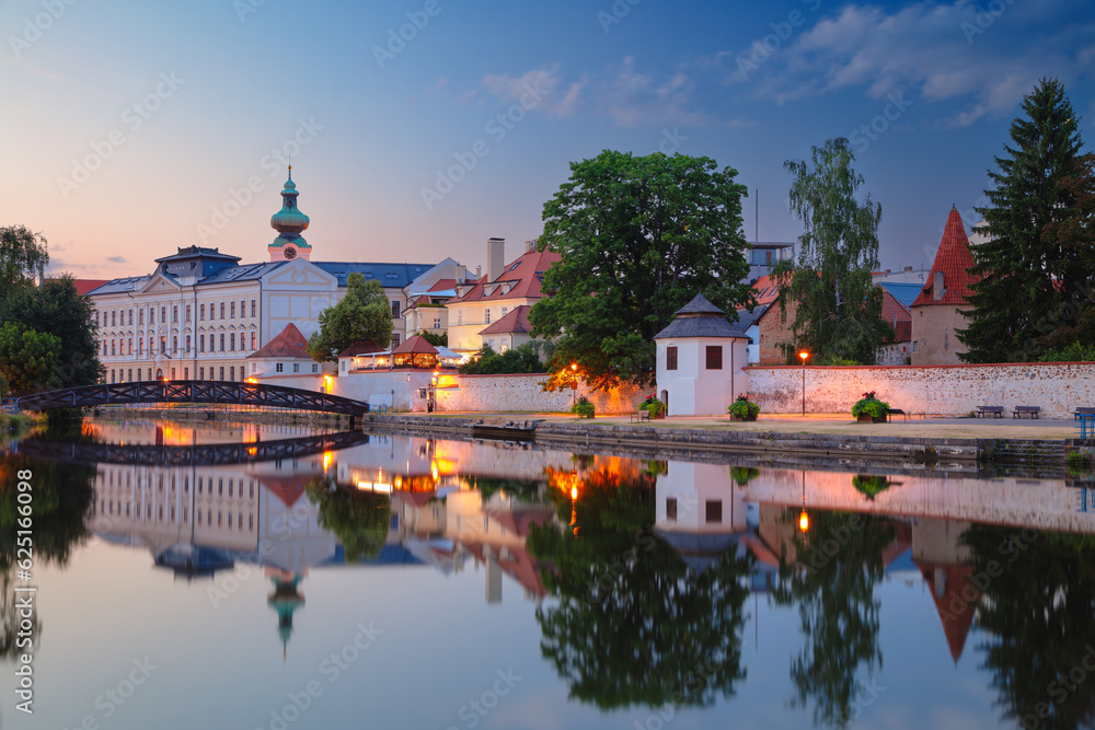 Ceske Budejovice, Czech Republic. Cityscape image of downtown Ceske Budejovice, Czech Republic with reflection of the city in the Malse River at summer sunset.