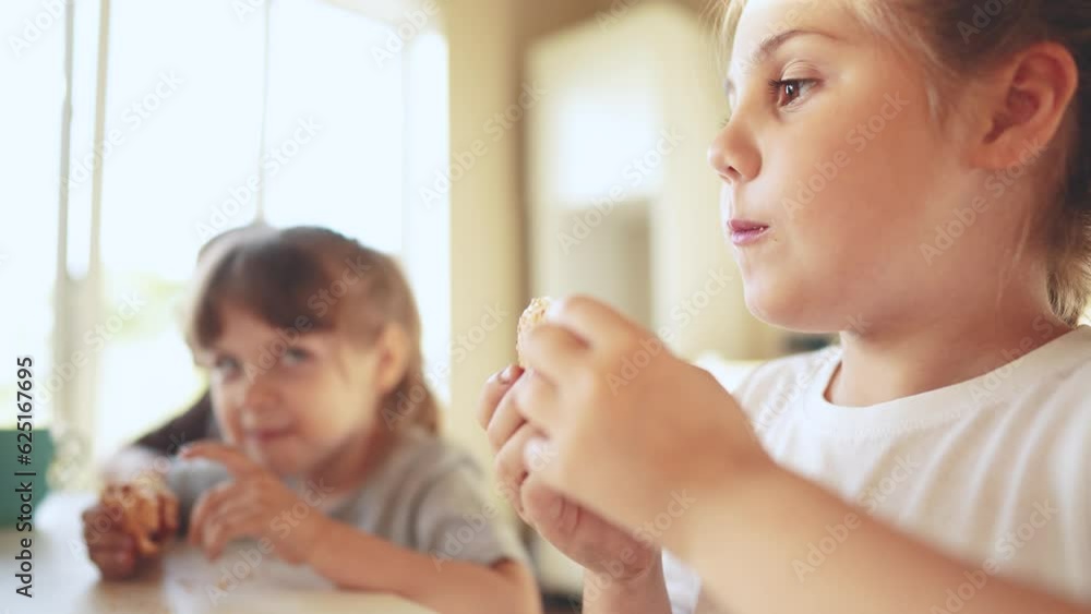 children eat burgers. fast food burger. a group of small children in the kitchen greedily eat fast food burgers. big family small kids having breakfast in the morning in kitchen eating meat burger children eat burgers. fast food burger. a group of small children in the kitchen greedily eat fast food burgers. big family small kids having breakfast in the morning in kitchen eating meat burger