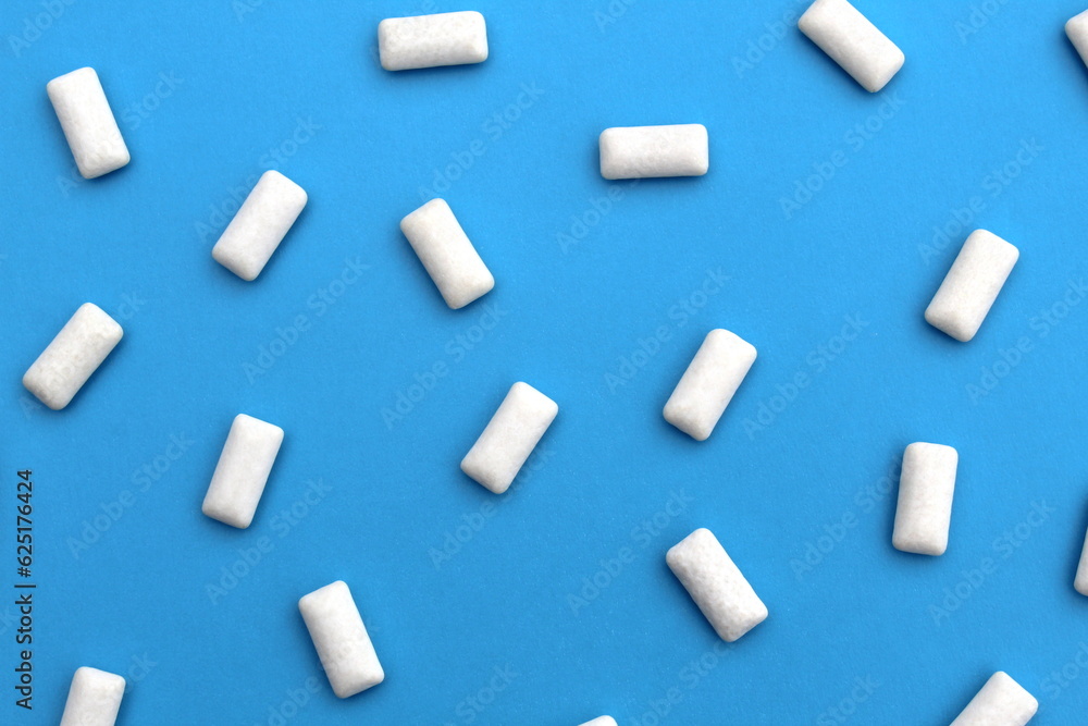Texture of white gum pads on a blue background. Texture of white gum pads on a blue background.