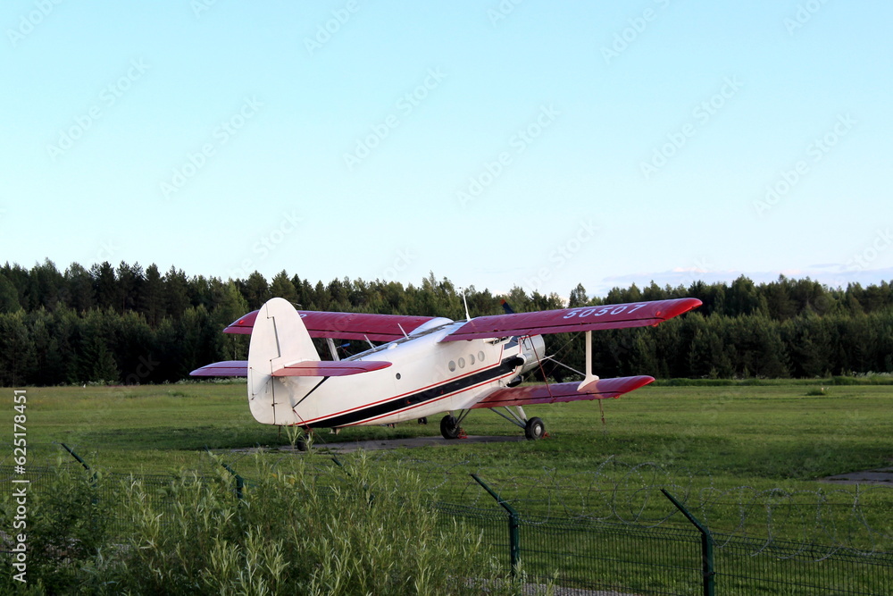 There is a small plane in a field. There is a small plane in a field.