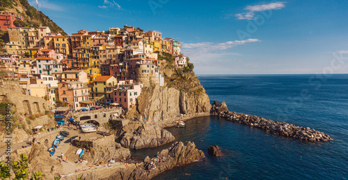 Schilderij op canvas the town of Monorollo on a mountain of colorful houses in Italy
