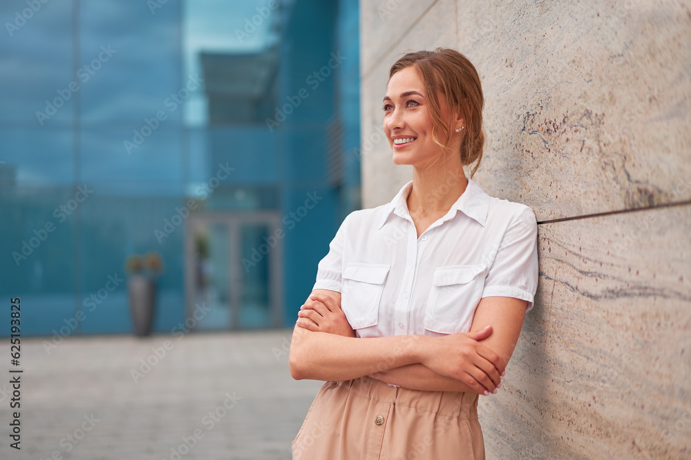 Businesswoman successful woman business person standing arms crossed outdoor corporate building exterior. Smile happy caucasian confidence professional business woman middle age Businesswoman successful woman business person standing arms crossed outdoor corporate building exterior. Smile happy caucasian confidence professional business woman middle age
