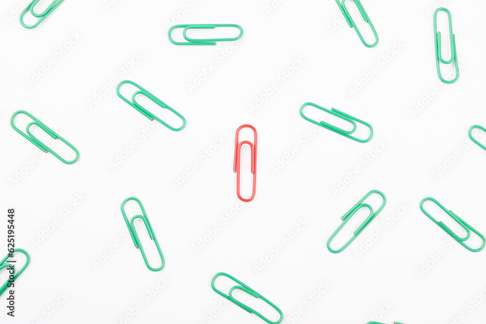 Top view of red paperclip with all green one, Leadership and extraordinary concept Top view of red paperclip with all green one, Leadership and extraordinary concept
