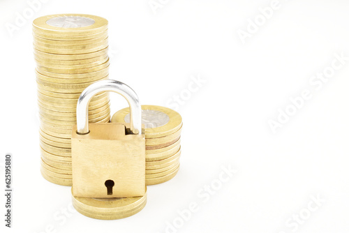 Coins with lock isolated on white background with clipping path, money security concept